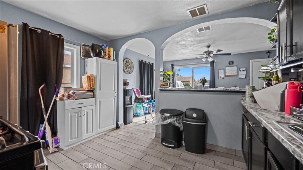 1030 North Western Avenue Colton, CA 92324 - Photo 10 of 32 a room with lots of appliances and furniture