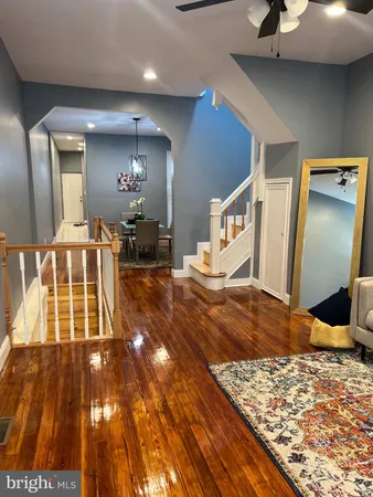 a living room with a couch and a rug