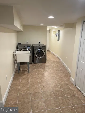 a bathroom with a sink a toilet and view