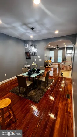 a living room with dining room and kitchen view