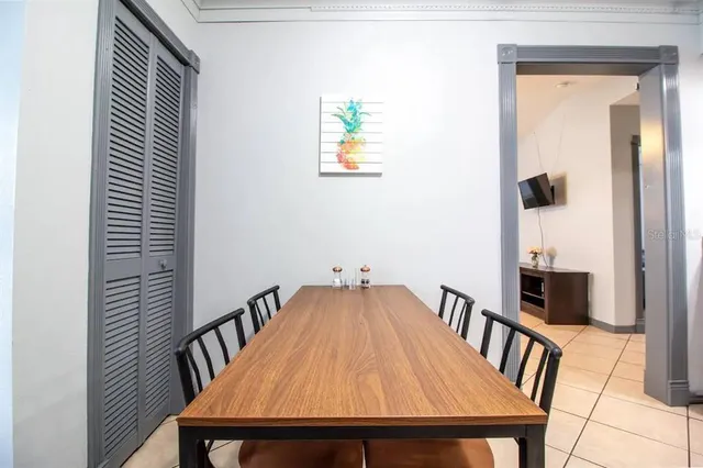 a dining room with furniture and window