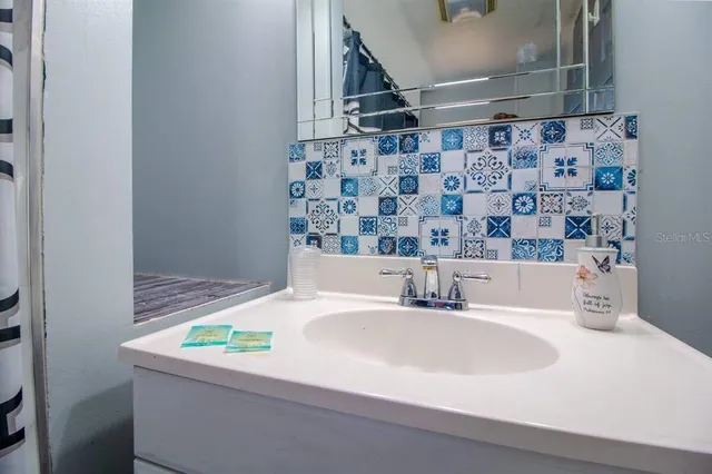 a bathroom with a sink and a bathtub