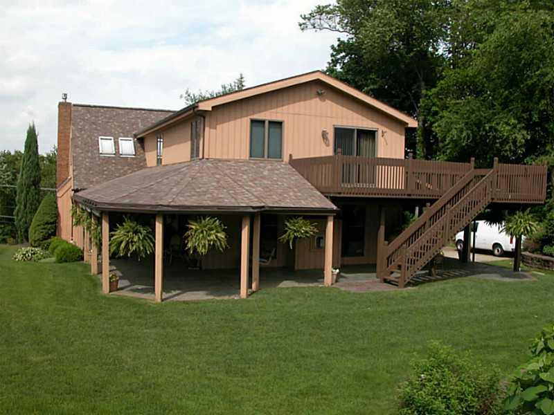 158 Scott Ridge Road Harmony, PA 16037 - Photo 24 of 25 a front view of house with a garden