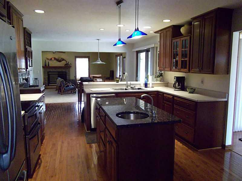158 Scott Ridge Road Harmony, PA 16037 - Photo 8 of 25 a kitchen with stainless steel appliances granite countertop a sink stove and refrigerator