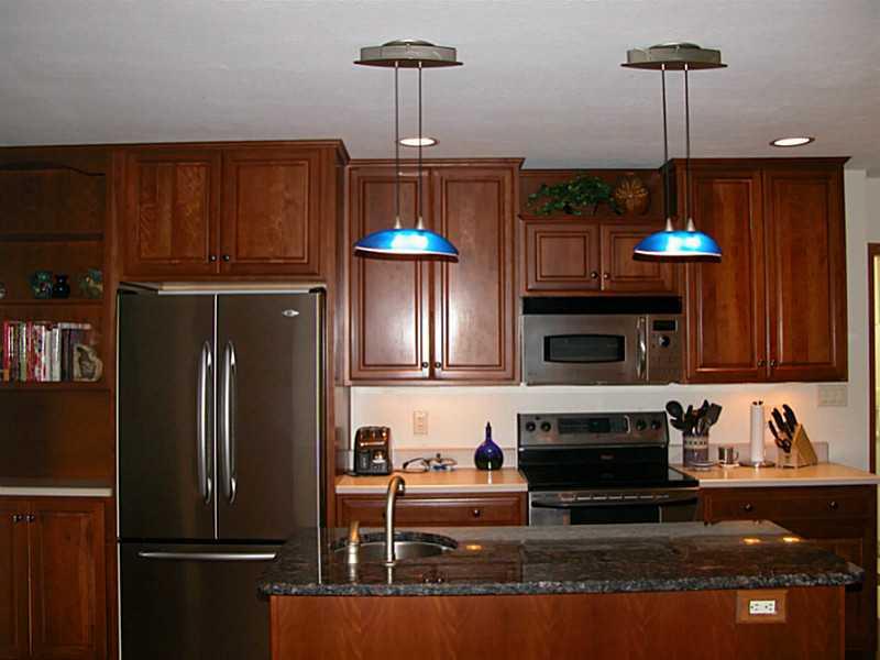 158 Scott Ridge Road Harmony, PA 16037 - Photo 9 of 25 a kitchen with kitchen island a counter space a stove and a refrigerator