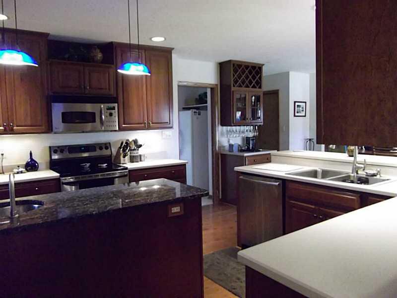 158 Scott Ridge Road Harmony, PA 16037 - Photo 10 of 25 a kitchen with stainless steel appliances granite countertop a sink stove and refrigerator