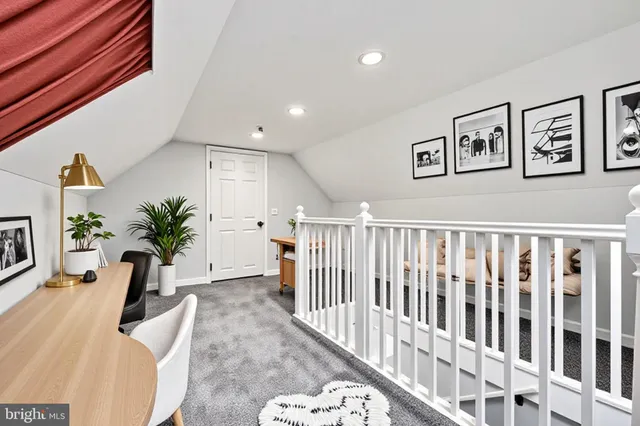 a view of a living room and a potted plant