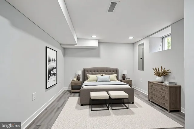 a bedroom with furniture and window