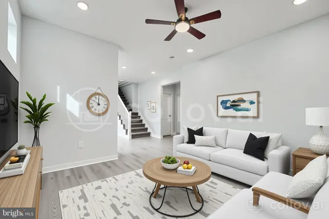 a living room with furniture and a clock