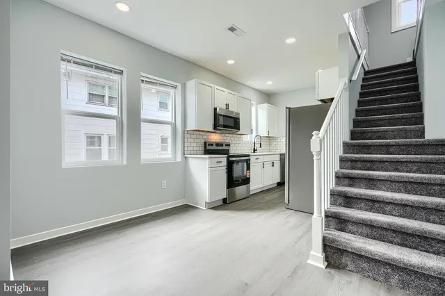 a view of kitchen and entryway with stove