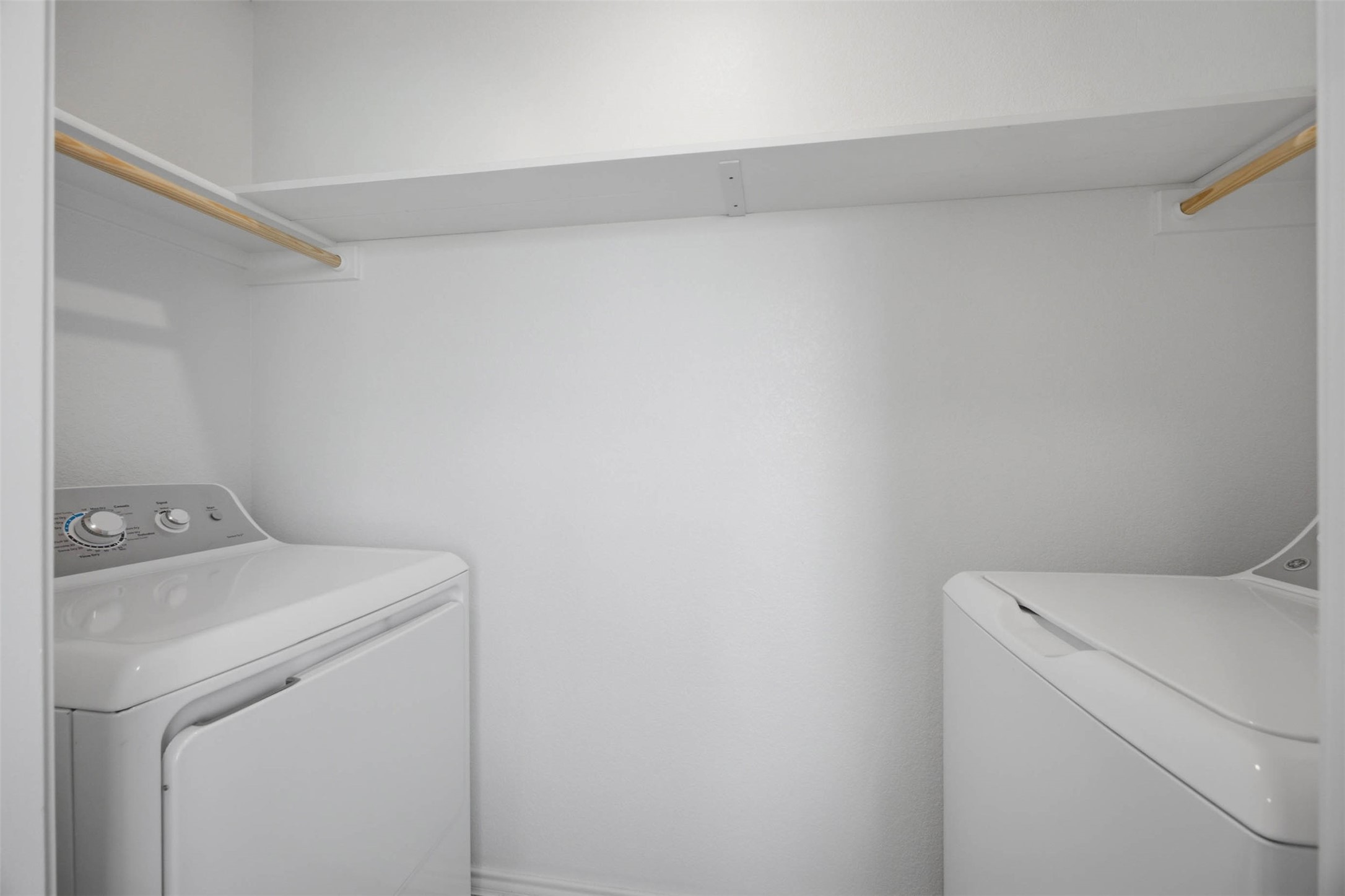 171 Cattle Queen Road Jarrell, TX 76537 - Photo 14 of 38 Functional utility space includes built-in shelving overhead.