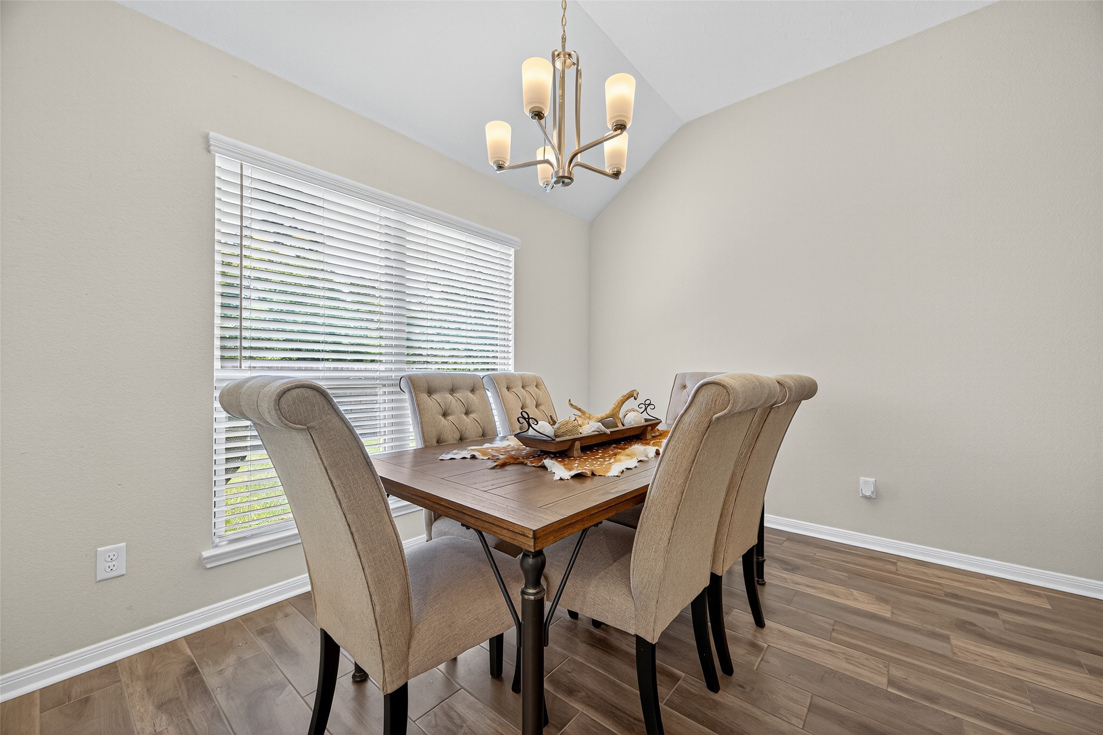 128 Red Deer Way Huntsville, TX 77320 - Photo 10 of 33 a view of a dining room with furniture window and wooden floor