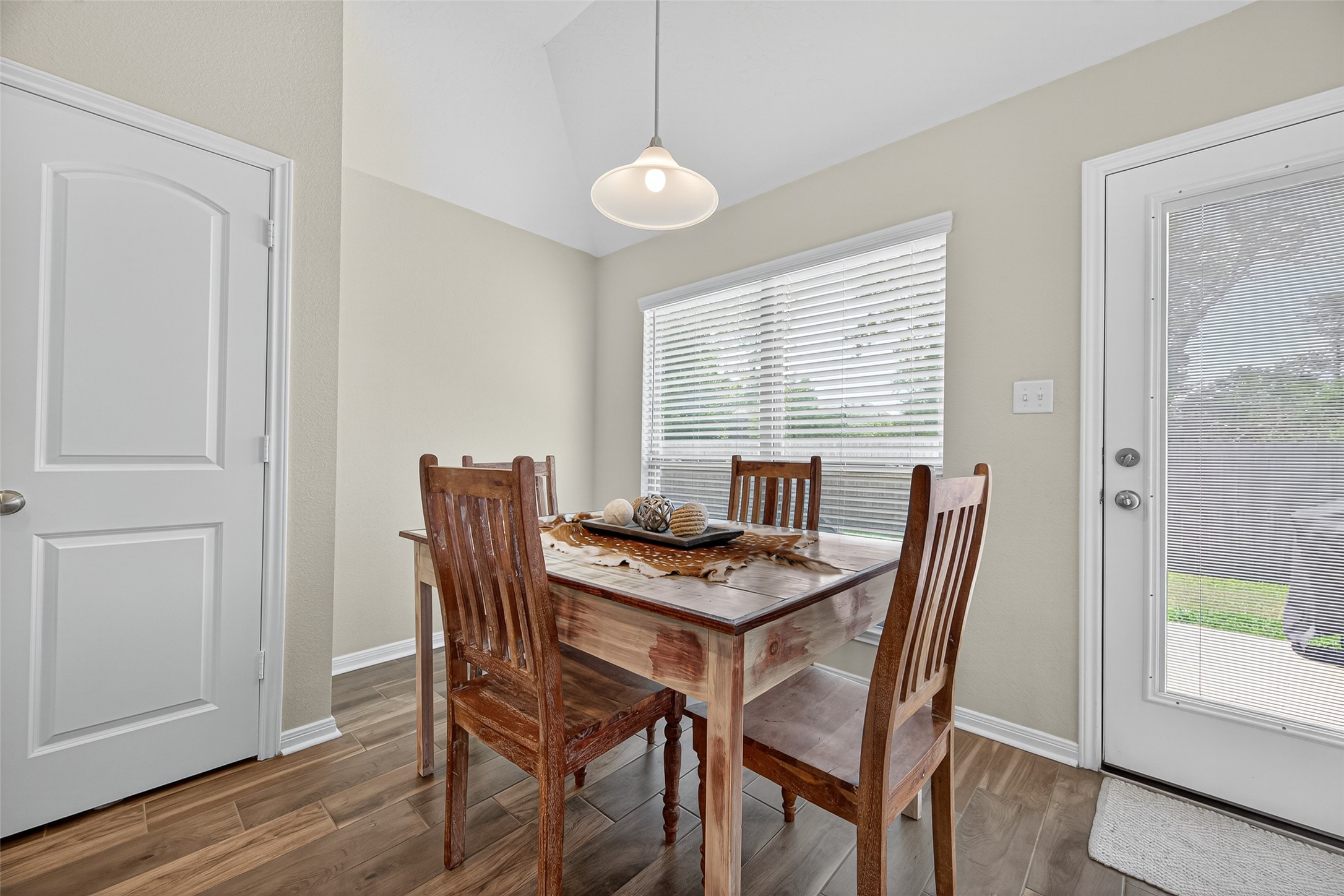 128 Red Deer Way Huntsville, TX 77320 - Photo 12 of 33 a view of a dining room with furniture window and wooden floor