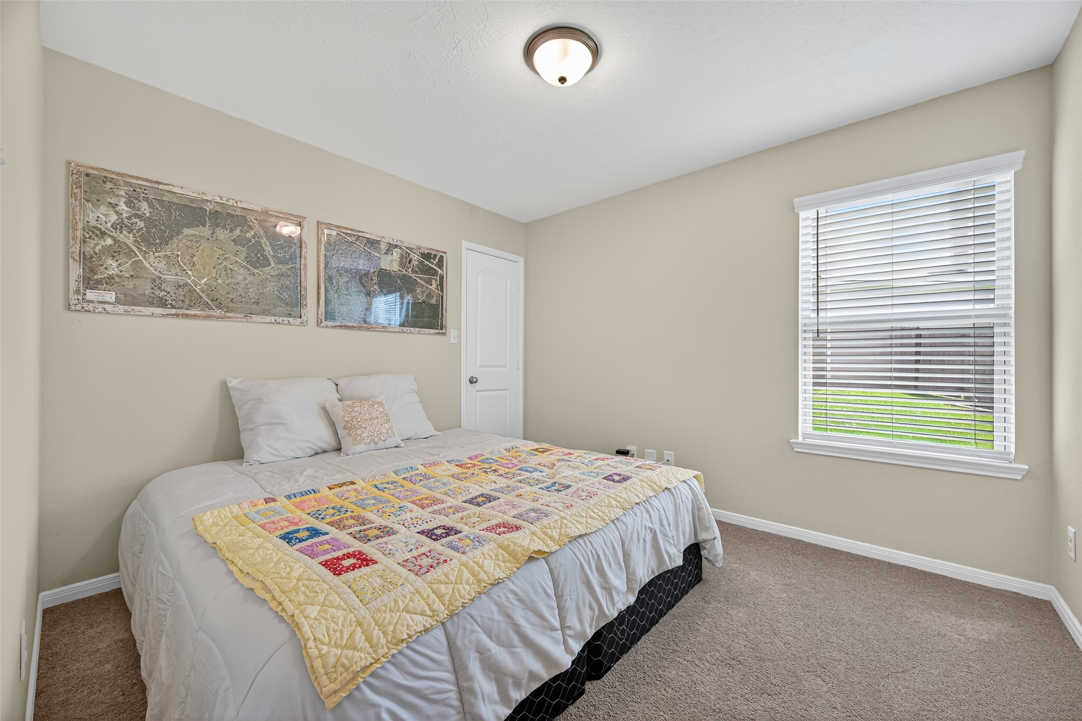 128 Red Deer Way Huntsville, TX 77320 - Photo 23 of 33 a bedroom with a bed and a window