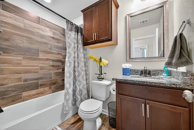 a view of a house with backyard porch and sitting area
