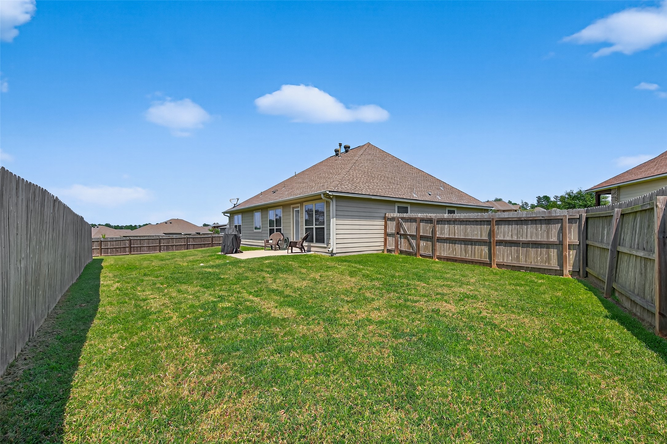 128 Red Deer Way Huntsville, TX 77320 - Photo 28 of 33 a view of a house with a yard