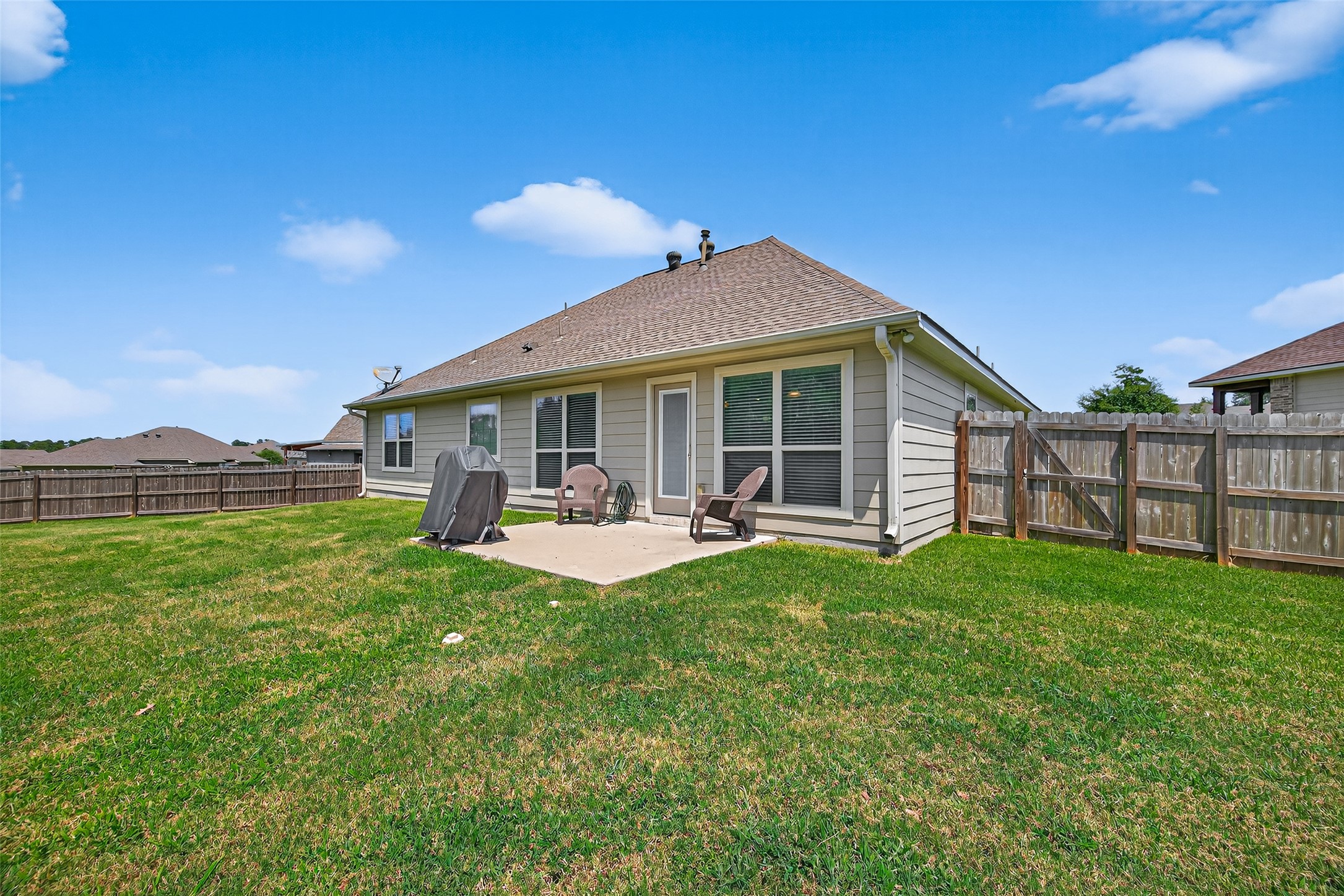 128 Red Deer Way Huntsville, TX 77320 - Photo 29 of 33 a view of a house with backyard porch and sitting area