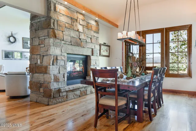 a kitchen with kitchen island granite countertop a sink cabinets and stainless steel appliances
