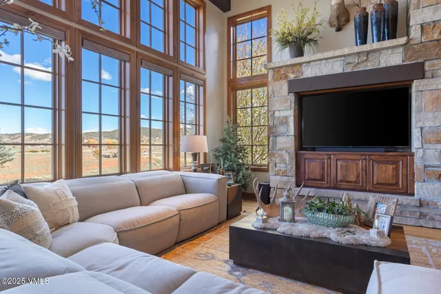 a kitchen with refrigerator and cabinets