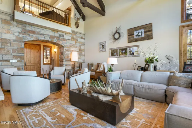 a spacious bedroom with bed and wooden floor