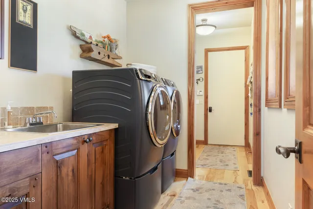 a living room with furniture and large windows