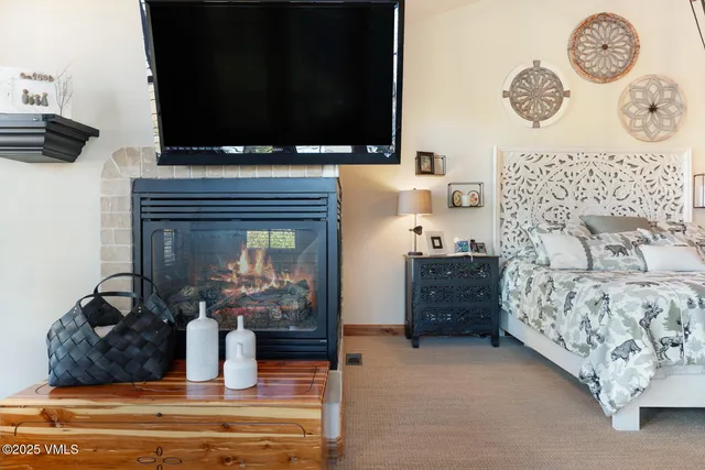 a kitchen with cabinets and chairs