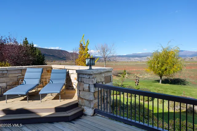 a view of a patio with table and chairs and potted plants