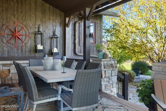 a bedroom with a bed and dresser with mirror