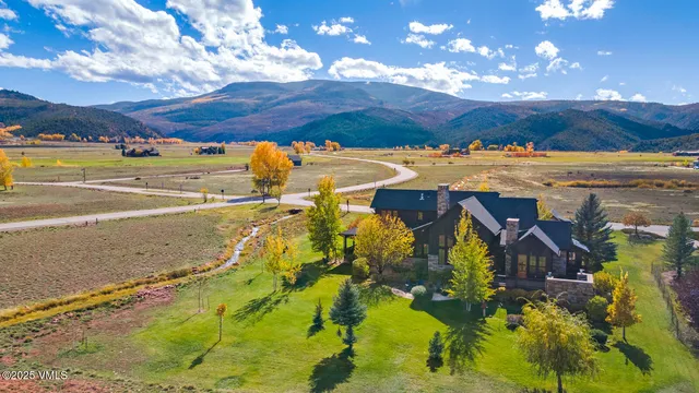 a view of an ocean with a building in the background
