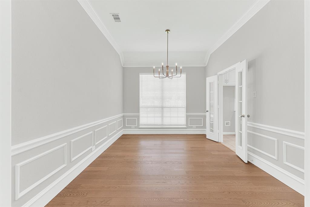 3500 Neiman Road Plano, TX 75025 - Photo 9 of 26 Elaborate crown molding lines the ceiling, with a chair rail and picture frame molding to give the dining room a touch of elegance.