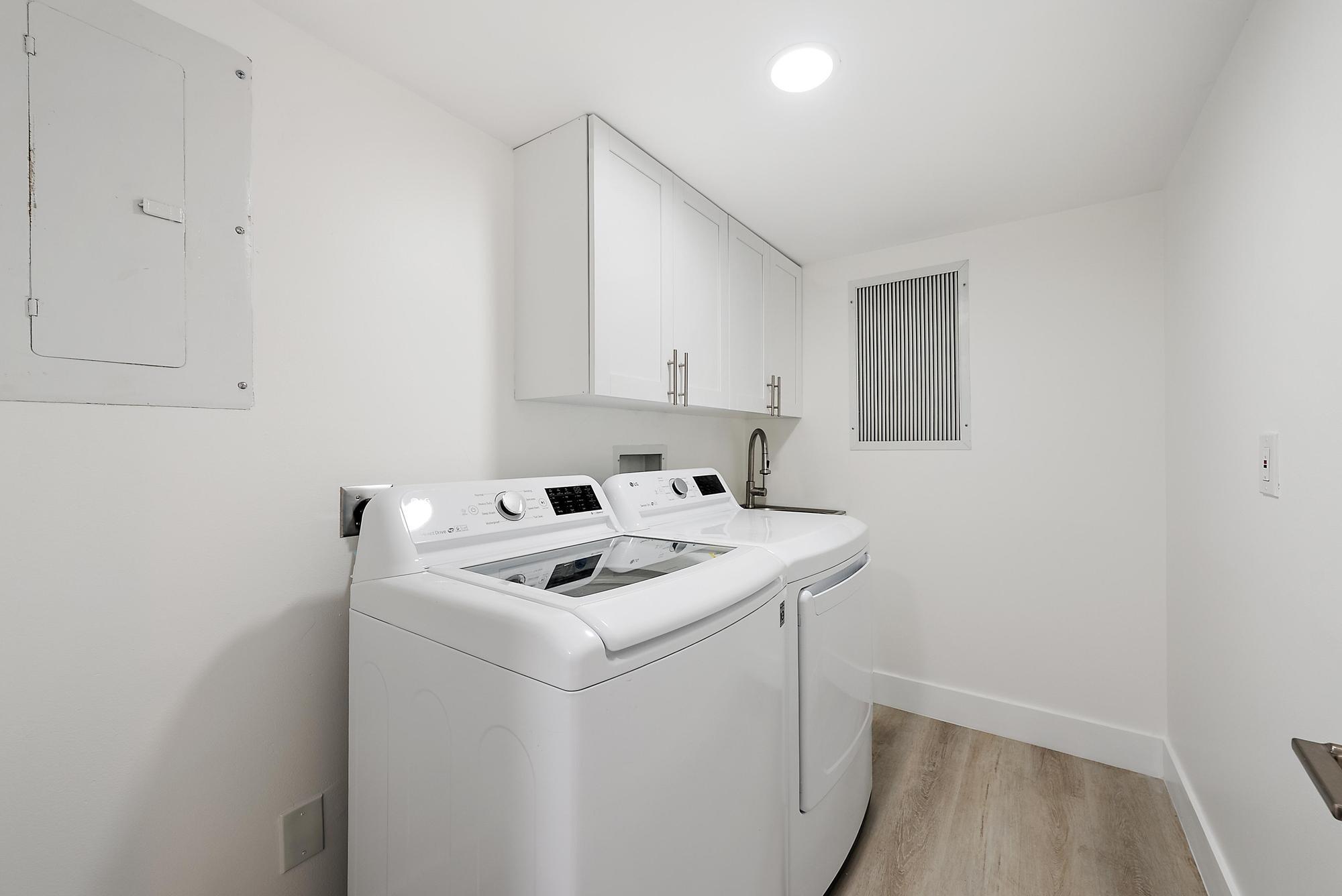 10459 Southeast Terrapin Place, Unit 101D Jupiter, FL 33469 - Photo 27 of 49 a utility room with dryer and washer