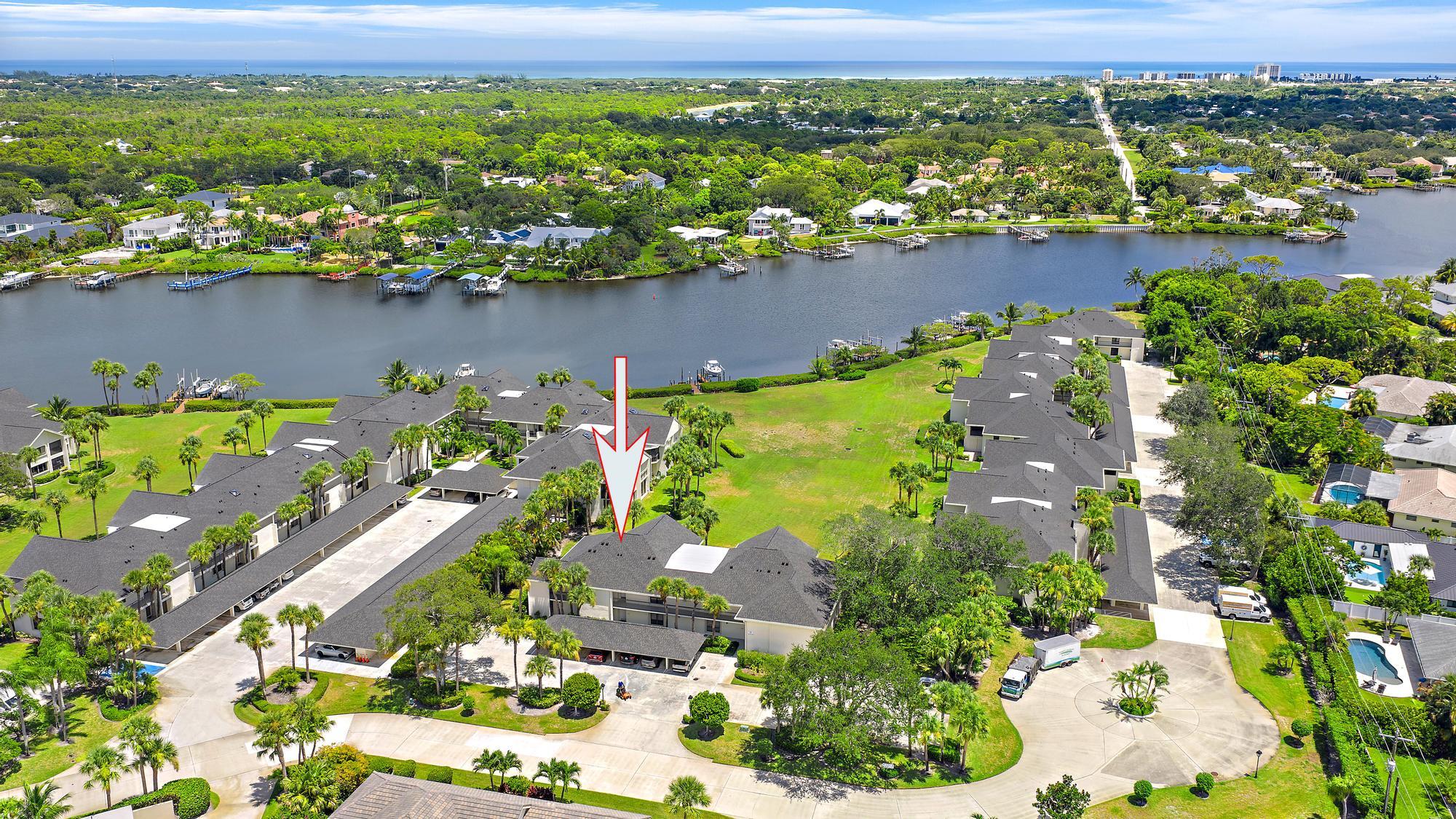 10459 Southeast Terrapin Place, Unit 101D Jupiter, FL 33469 - Photo 31 of 49 an aerial view of a houses with a lake view
