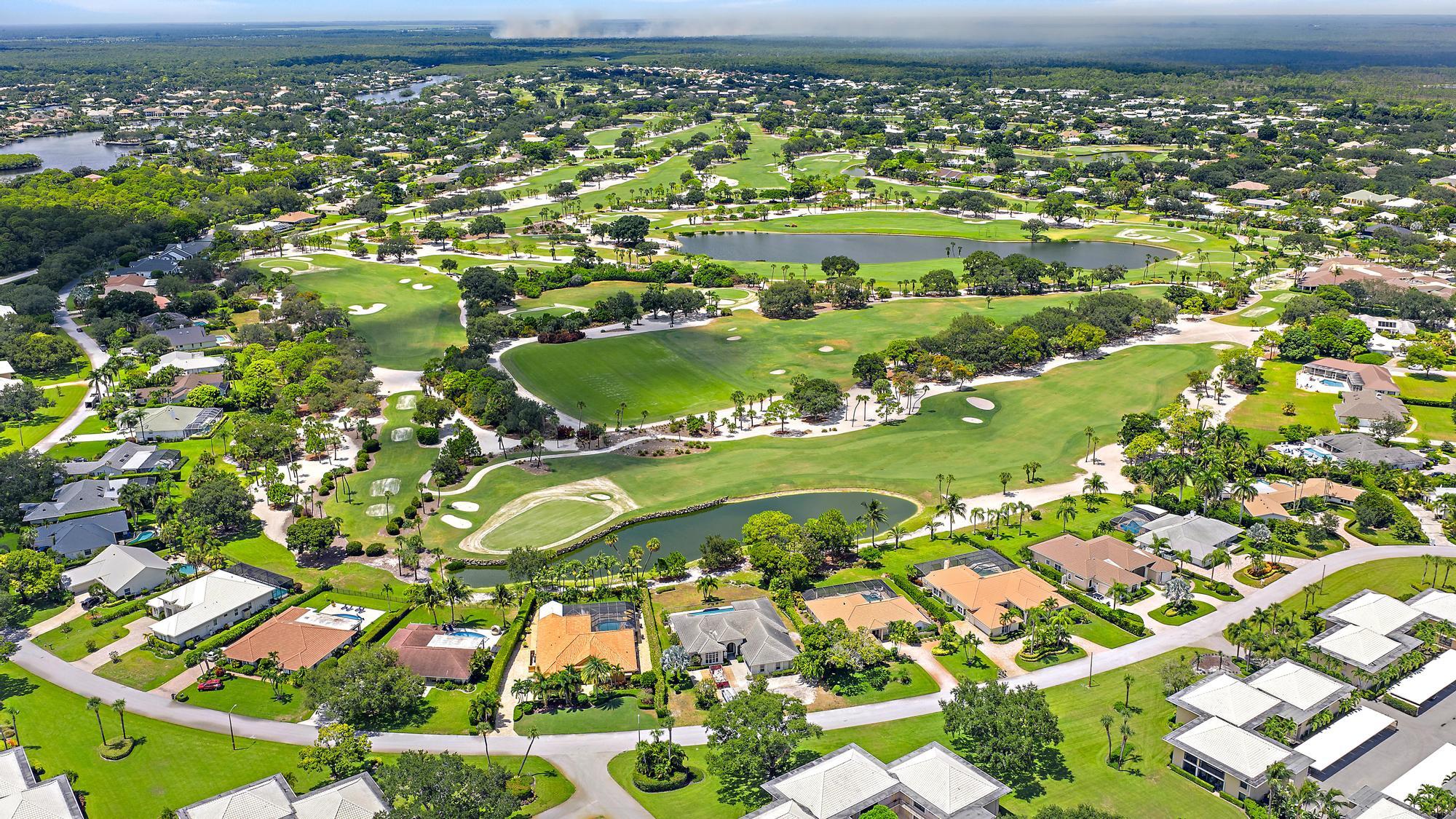 10459 Southeast Terrapin Place, Unit 101D Jupiter, FL 33469 - Photo 36 of 49 an aerial view of residential houses with outdoor space