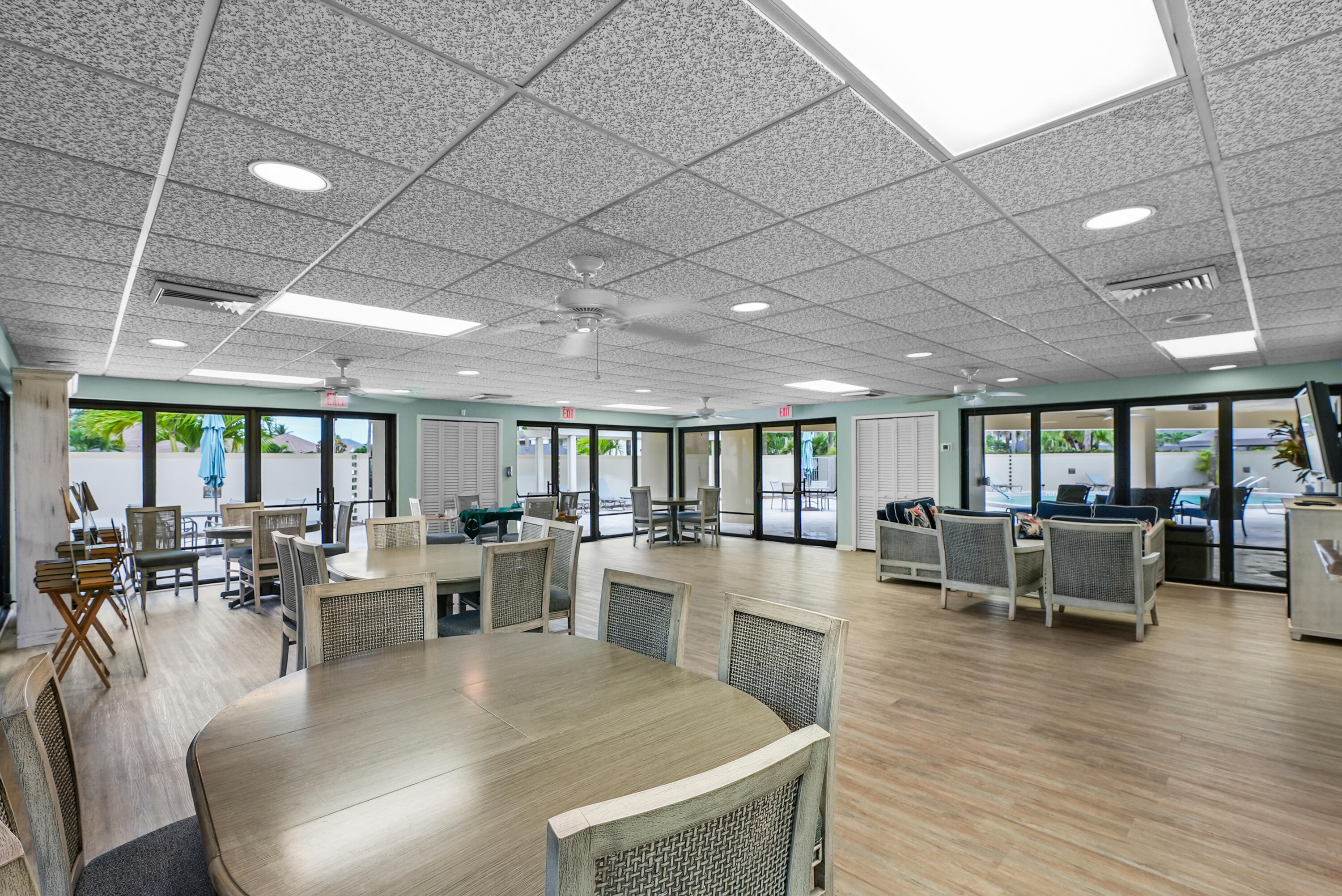 10459 Southeast Terrapin Place, Unit 101D Jupiter, FL 33469 - Photo 40 of 49 a view of a dining room with furniture window and wooden floor