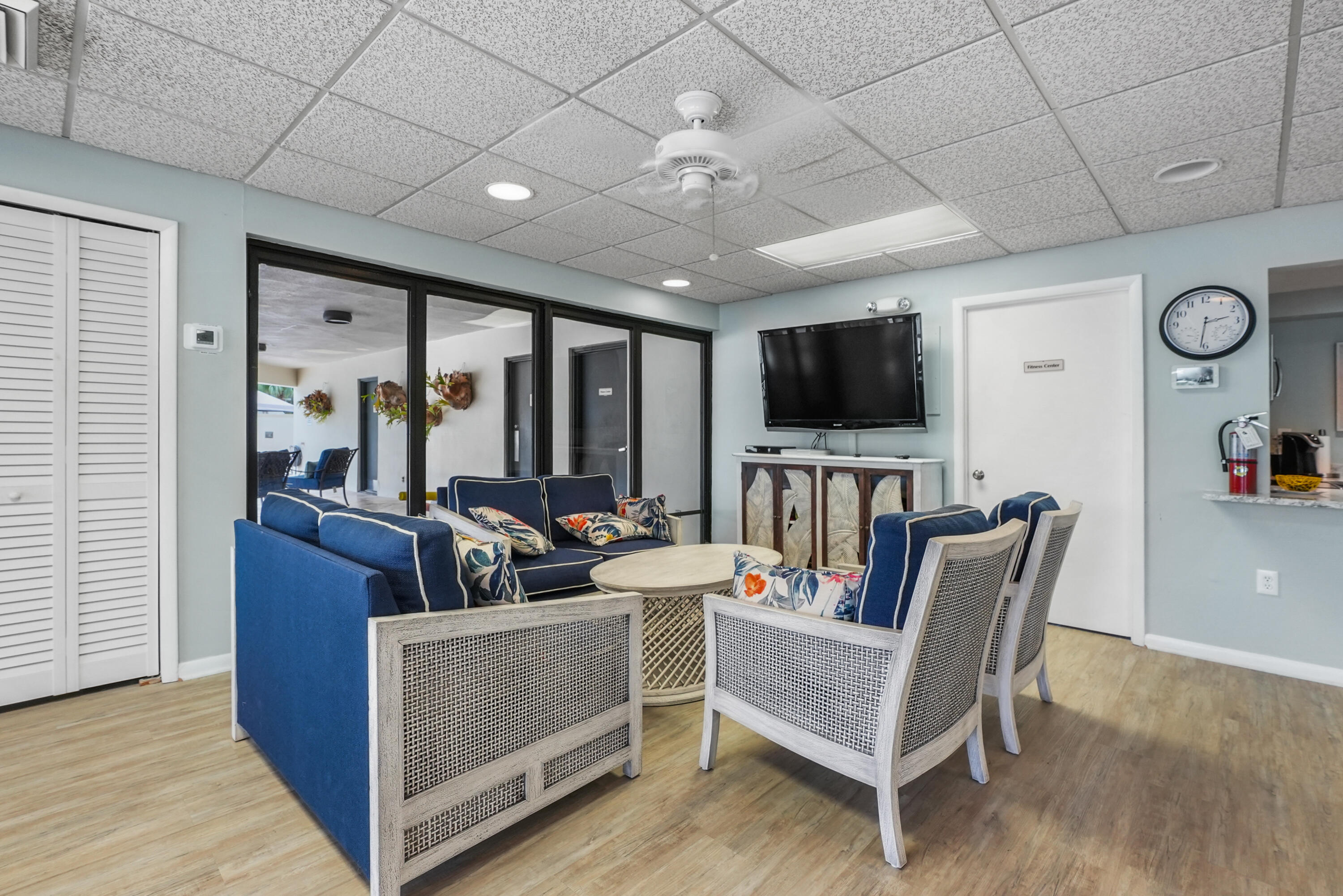 10459 Southeast Terrapin Place, Unit 101D Jupiter, FL 33469 - Photo 43 of 49 a view of a livingroom with furniture flat screen tv and wooden floor