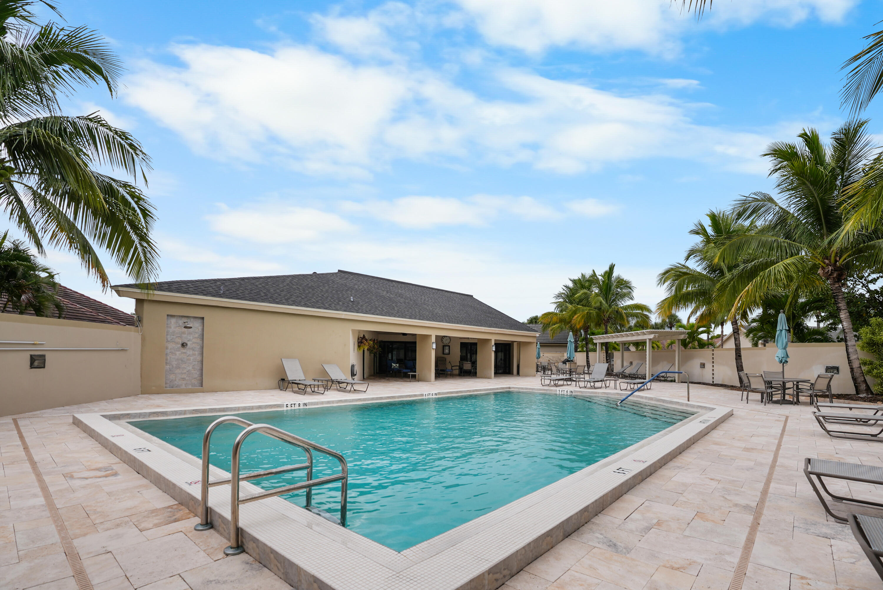 10459 Southeast Terrapin Place, Unit 101D Jupiter, FL 33469 - Photo 47 of 49 a view of a house with a backyard