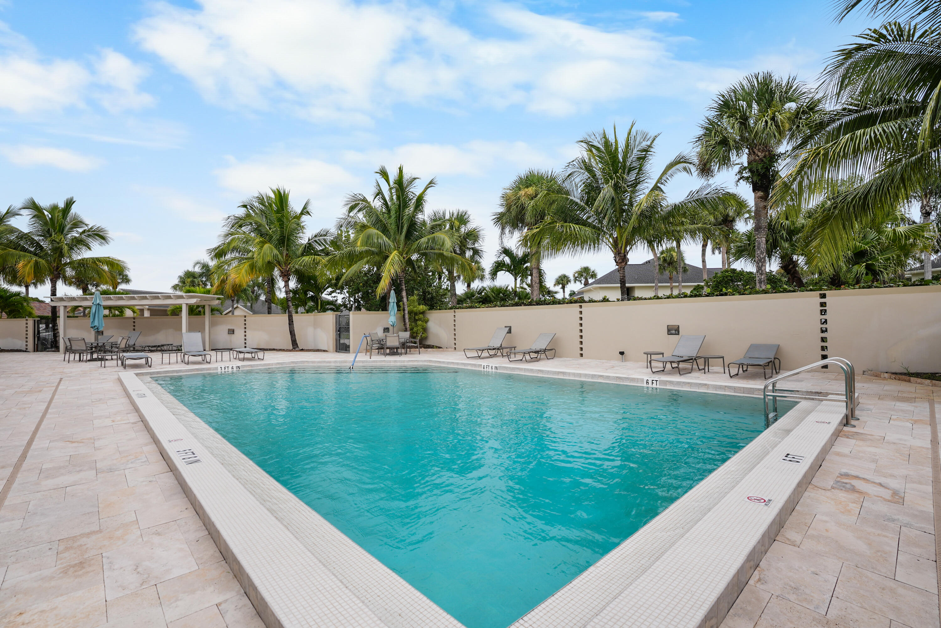 10459 Southeast Terrapin Place, Unit 101D Jupiter, FL 33469 - Photo 48 of 49 a view of swimming pool with a garden