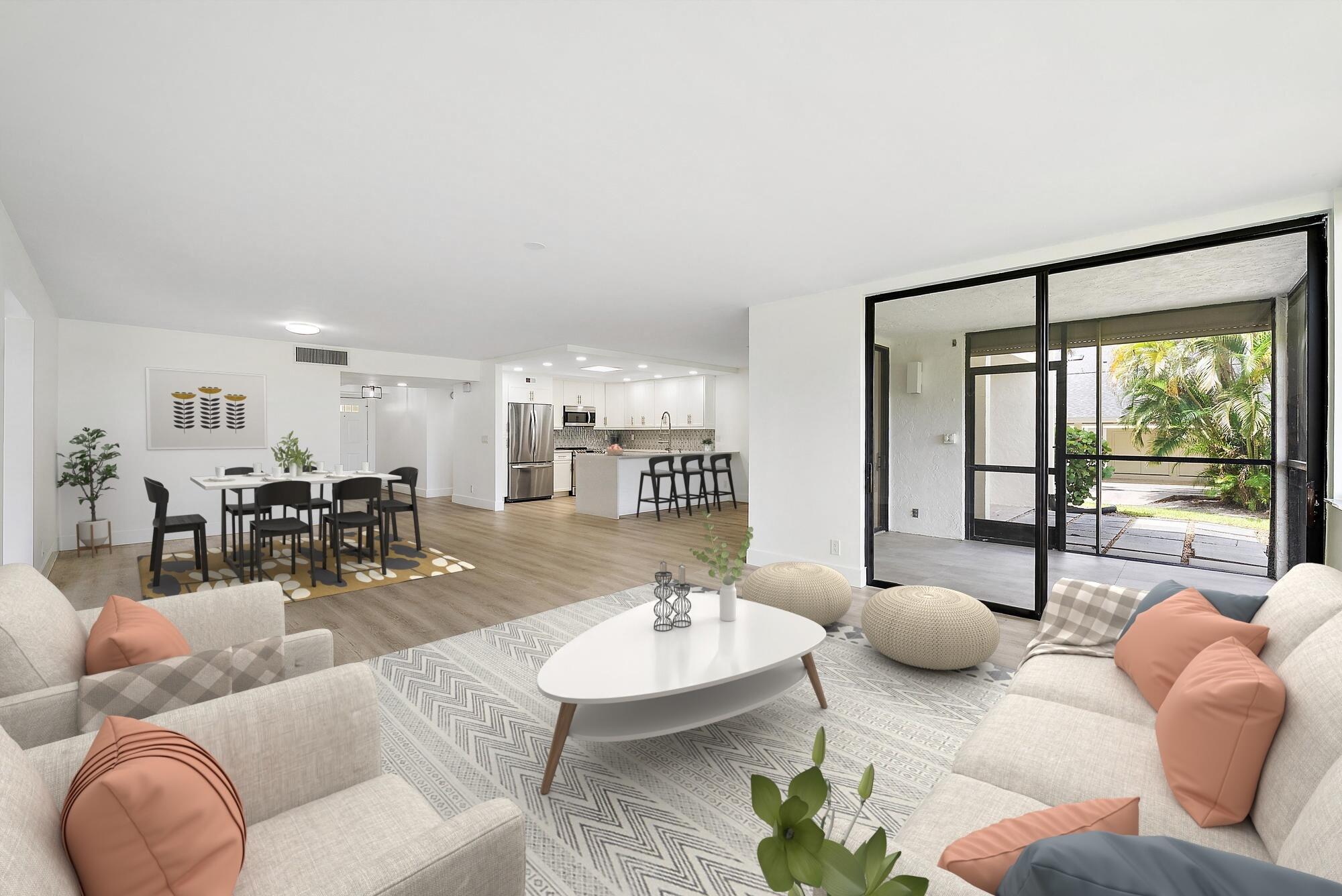 10459 Southeast Terrapin Place, Unit 101D Jupiter, FL 33469 - Photo 5 of 49 a living room with furniture and a large window