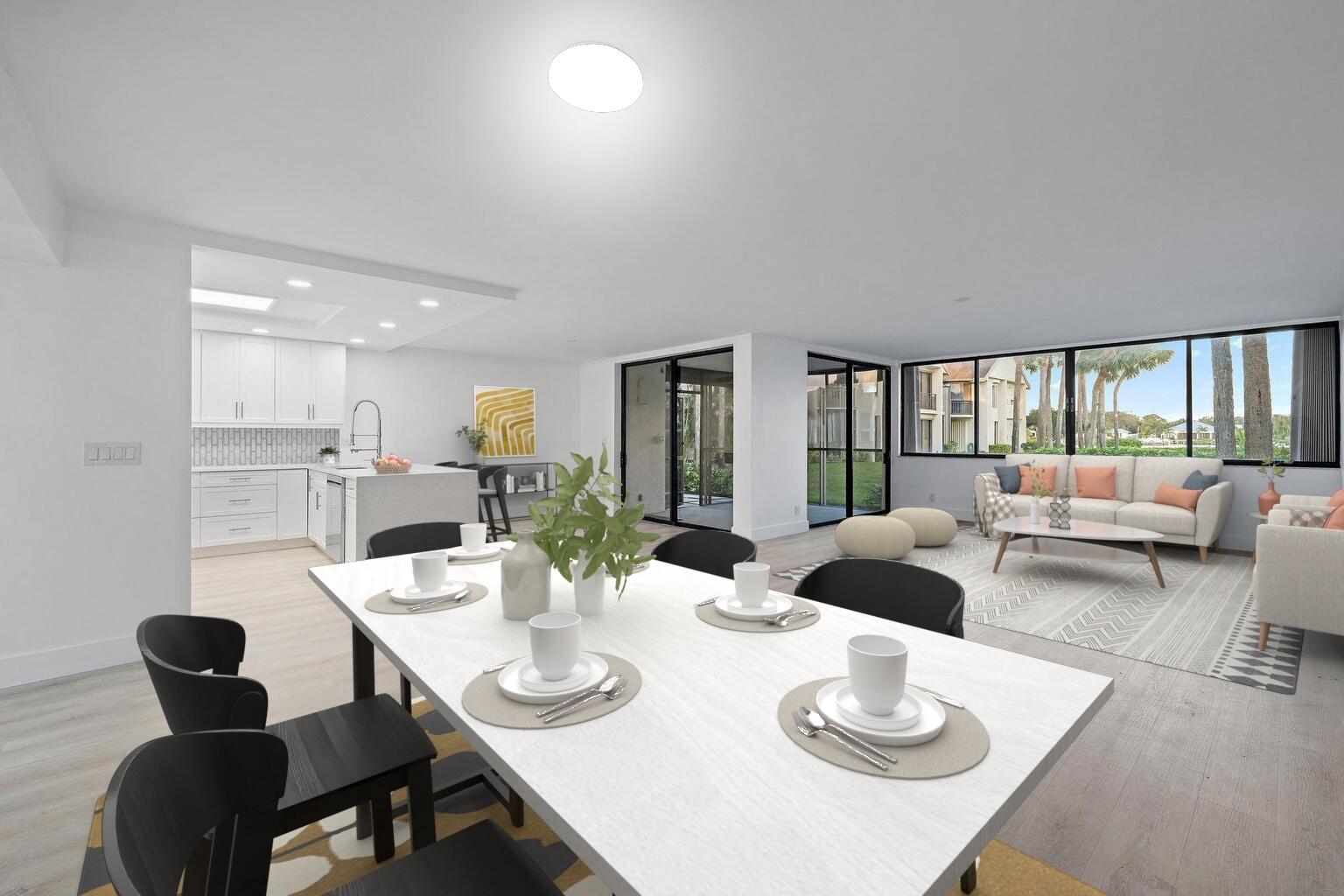 10459 Southeast Terrapin Place, Unit 101D Jupiter, FL 33469 - Photo 9 of 49 a dining room with furniture a large window and a view of kitchen