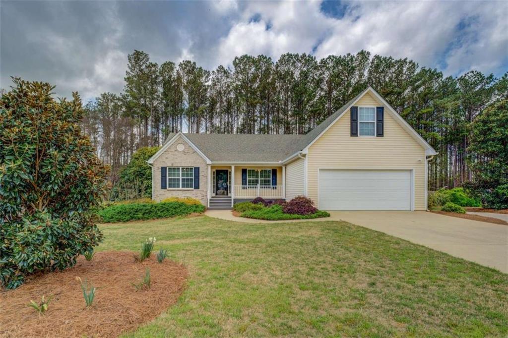 116 Laurel Lane Social Circle, GA 30025 - Photo 1 of 1 a front view of a house with garden