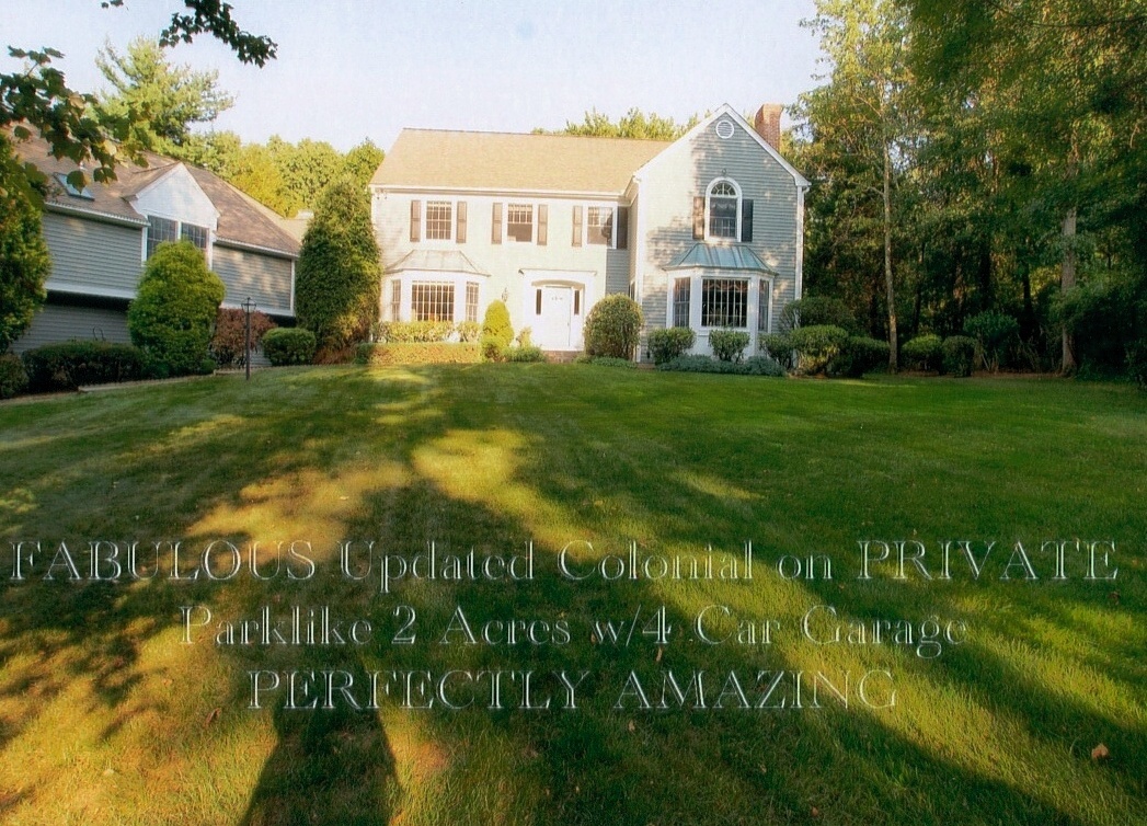 43 Signal Hill Road Wilton, CT 06897 - Photo 1 of 25 a front view of a house with a garden