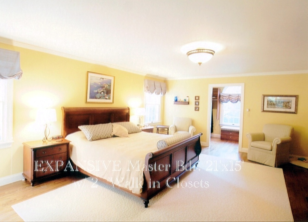 43 Signal Hill Road Wilton, CT 06897 - Photo 13 of 25 a bedroom with a bed and a couch