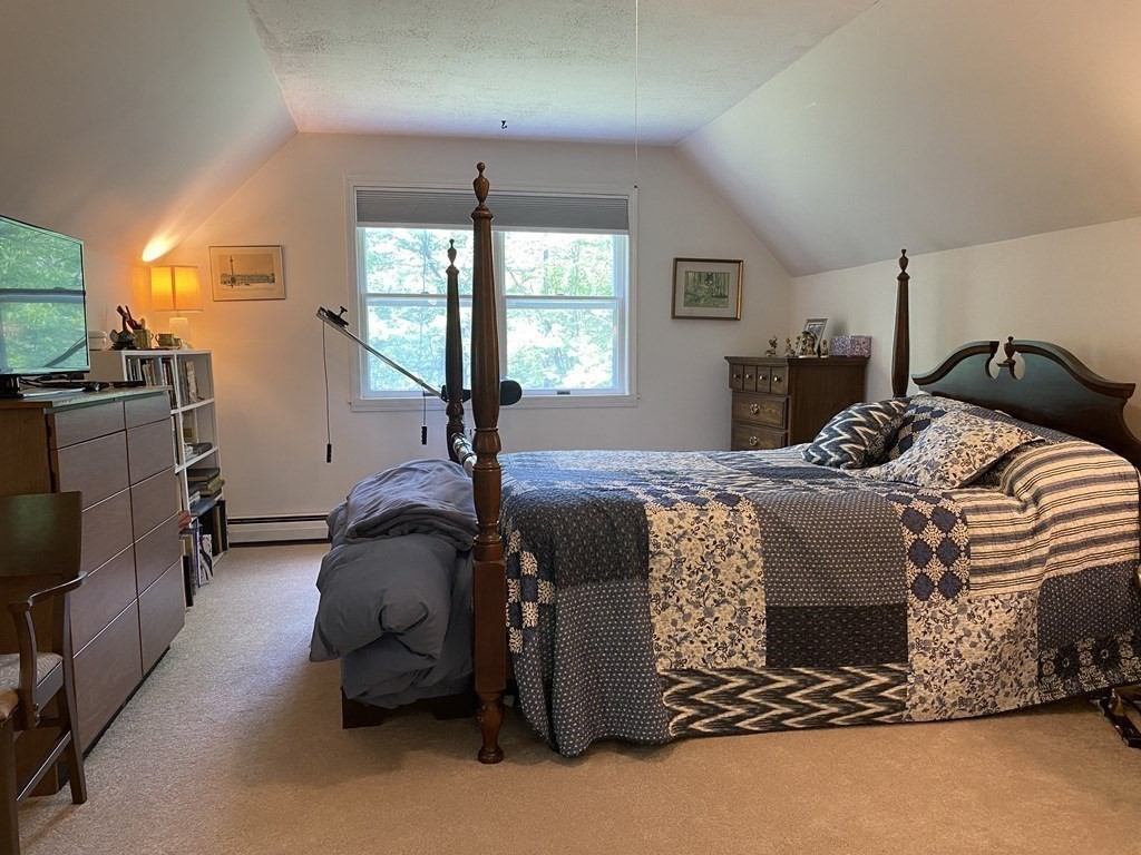 76 Main Road Gill, MA 01354 - Photo 26 of 36 a bedroom with a bed lamp and a large window