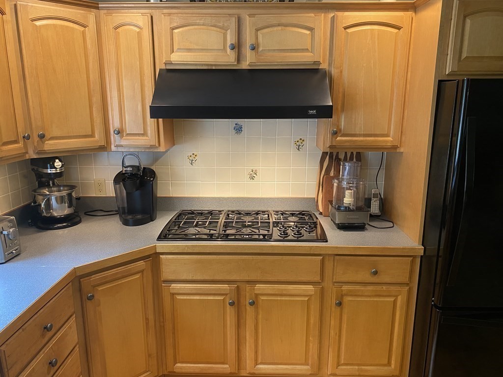 76 Main Road Gill, MA 01354 - Photo 31 of 36 a kitchen with granite countertop cabinets and black appliances