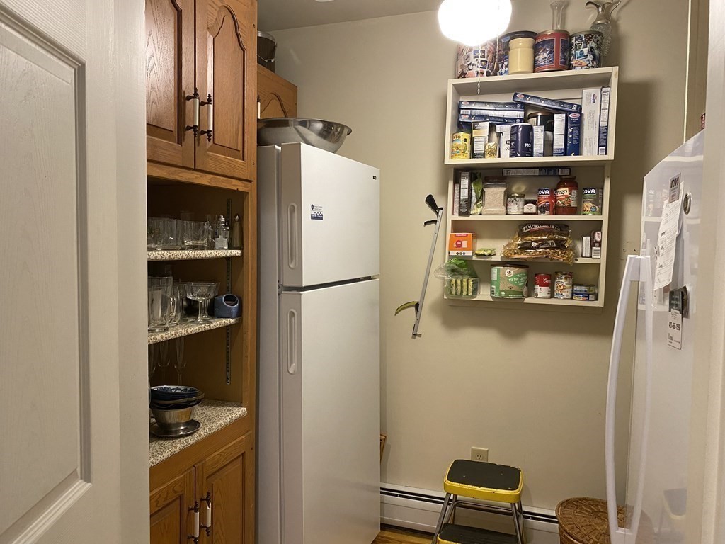 76 Main Road Gill, MA 01354 - Photo 32 of 36 a kitchen with a refrigerator and cabinets