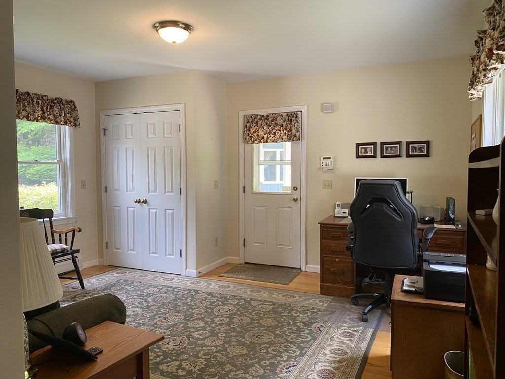 76 Main Road Gill, MA 01354 - Photo 33 of 36 a living room with furniture and a window
