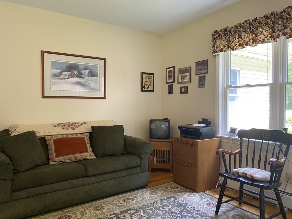 76 Main Road Gill, MA 01354 - Photo 34 of 36 a living room with furniture and a large window