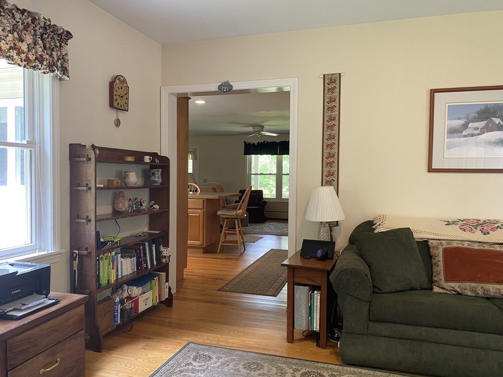 76 Main Road Gill, MA 01354 - Photo 35 of 36 a living room with furniture cabinets and window