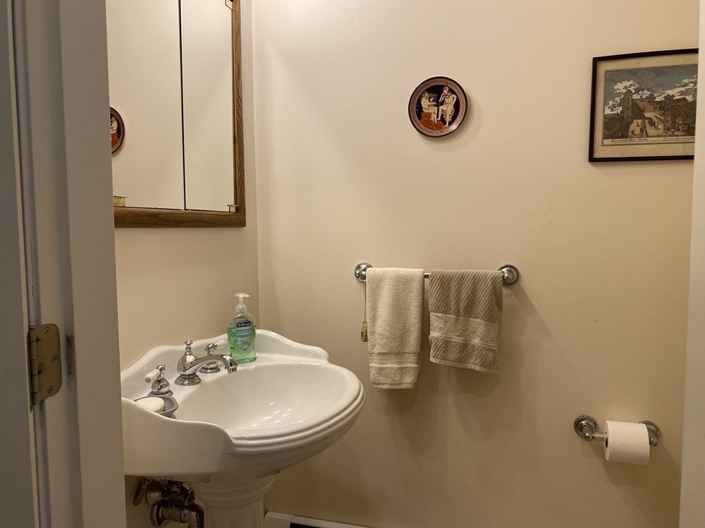 76 Main Road Gill, MA 01354 - Photo 10 of 36 a bathroom with a sink a toilet and a mirror