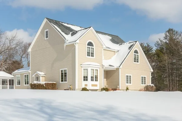 a view of a white house with a outdoor space